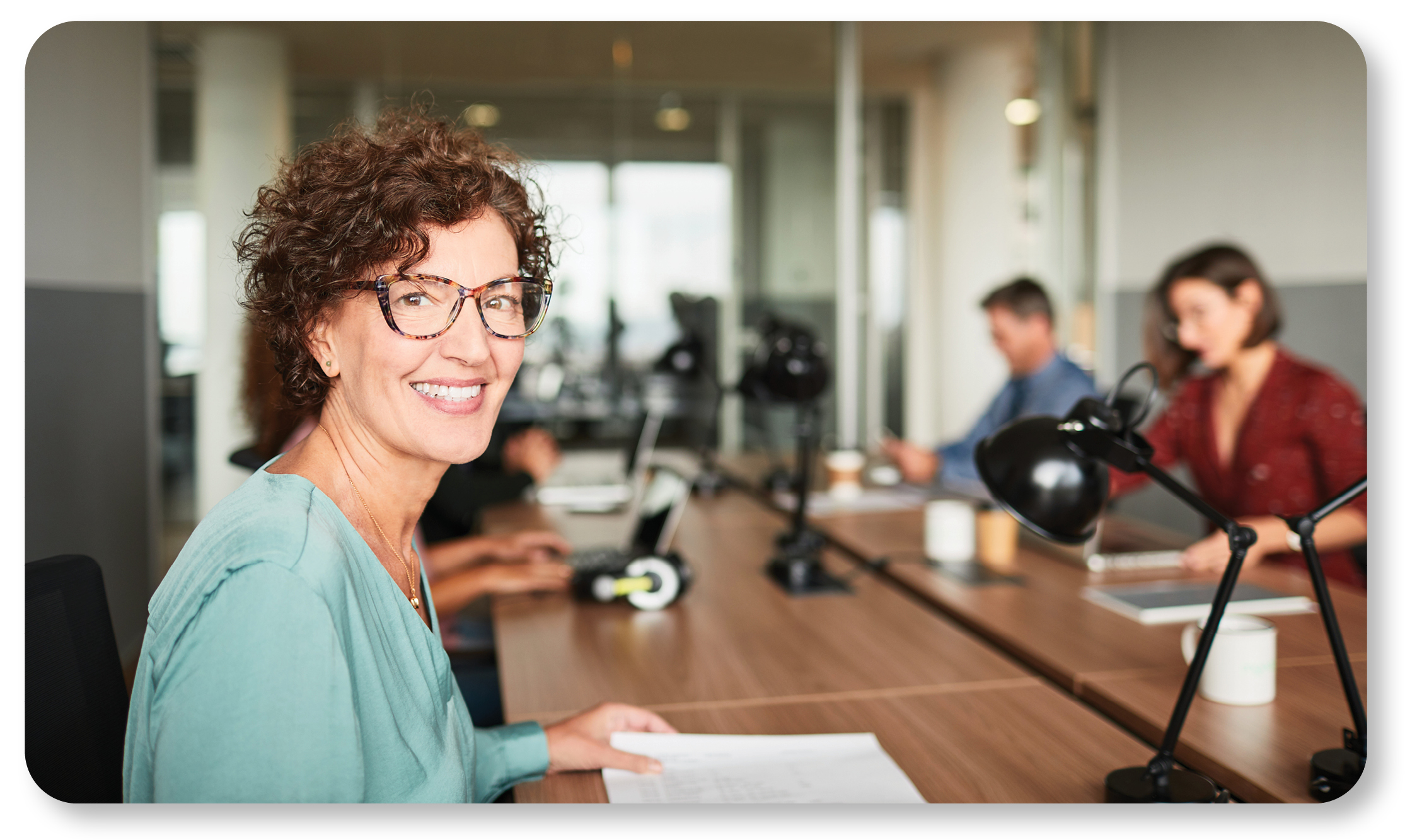 woman at table smiling